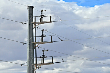 Cut out fuses allow segments to be taken offline so maintenance can be done safely. Small Yagi antenna on top of pole used to monitor power levels and control switching gear 