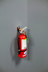 Obraz premium red fire extinguisher