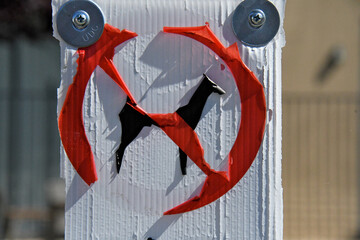 Tape Shrinkage turns Black Labrador Retriever into Doberman Pinscher on “No Dogs Allowed Sign”