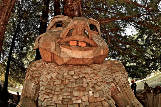 Closeup of &ldquo;Basse Buller&rdquo;, The Painting Troll by Thomas Dambo sitting in redwood grove 