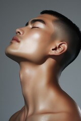 Captivating male portrait showcasing natural beauty and defined features in dramatic lighting