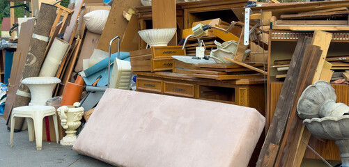 Bulky waste furniture is on the street for recycling at the recycling center