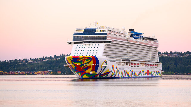 Seattle - June 8, 2025; Cruise ship Norwegian Encore turns in Elliott Bay at dawn after Alaska Cruise