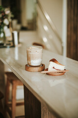 Iced Coffee and Cheesecake on Countertop