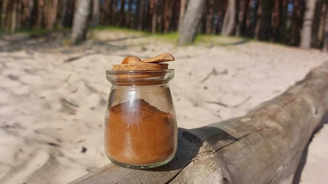Ground chaga close-up in a glass jar