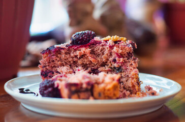 Delicious blackberry cake with walnuts enjoying a cozy afternoon snack