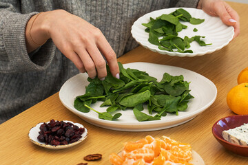 Healthy meal preparation with fresh spinach and seasonal ingredients