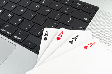 Close-up of five cards on a keyboard, suggesting technology, work, or gaming themes with a focus on...