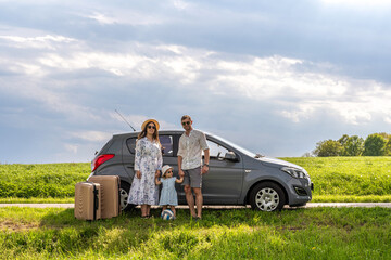 Family with child. Travel by car journey. Luggage sunshine weekend cheerful.