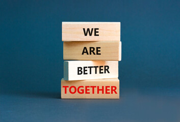 We are better together symbol. Concept words phrase We are better together on beautiful wooden blocks. Beautiful grey paper background. Business We are better together concept. Copy space.