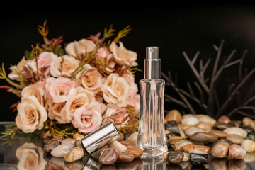 clear glass perfume bottles with metallic tops, styled for a luxury branding photo.