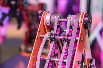 Close-up of an industrial robot arm, metallic components, gears, rods, plates or blades, linear...