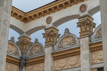 Grand, old Soviet architectural structure with historical significance Outdoor setting under cloudy...