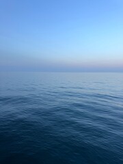 Blue sea calm waters and blue sky.