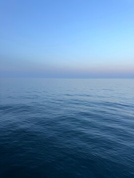 Blue sea calm waters and blue sky.