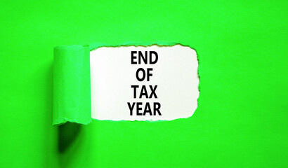 End of tax year symbol. Concept words phrase End of tax year on beautiful white paper. Beautiful green paper background. Business End of tax year concept. Copy space.