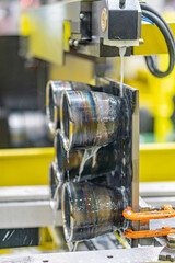 Close-up of an automated metal or plastic coating process in an industrial setting Grayscale image...