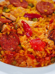 Close up of fine tasty Spanish paella dinner with rice and high quality chorizo sausage. Mediterranean style dish. Popular food made from premium ingredients.