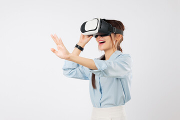 VR headset virtual reality for Asian woman in glasses game future; happy girl touches screen, interacts in virtual world, enjoying vr experience, and online app, isolated studio white background