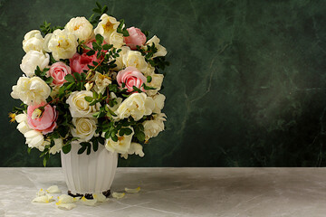 Still life with beautiful rose hips and cream rose flowers in vase on elegant modern table, abstract floral arrangement. template for your design with place for text, minimalist beauty concept,