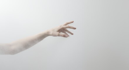 Pale hand reaching out against white background