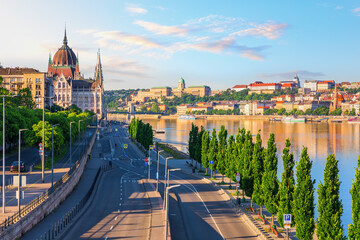 Budapest street along the Danube River with Parliament and Buda Castle skyline, Hungary