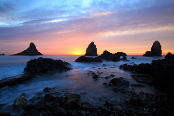 Cyclops stacks in Aci Trezza at sunrise, Sicily, Italy