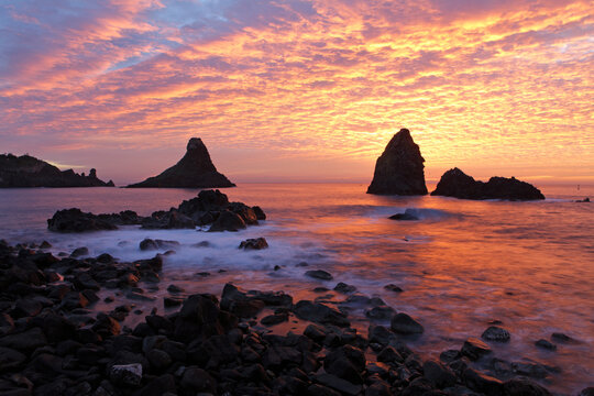 Cyclops stacks in Aci Trezza at sunrise, Sicily, Italy