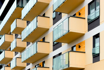 Modern residential property with a beautiful balcony, facade. A multistory condominium offering