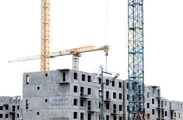Urban construction site with a crane working on a modern high-rise residential building. The