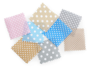 Samples of fabrics with polka dot pattern isolated on white, top view