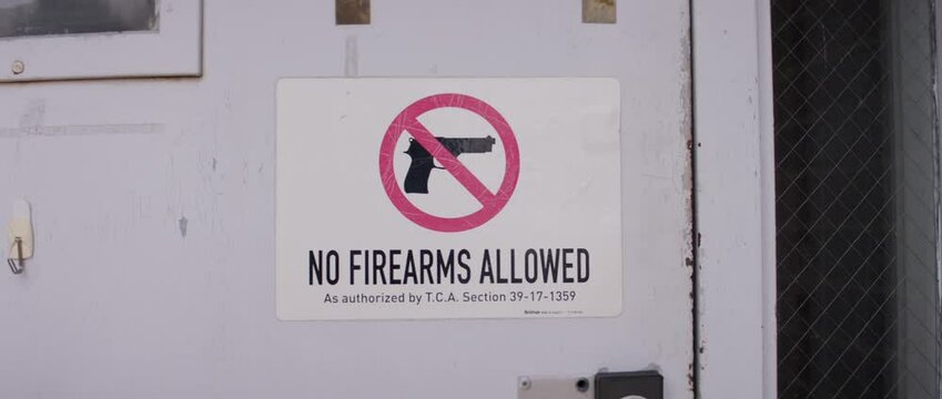 Sign prohibiting firearms in public space