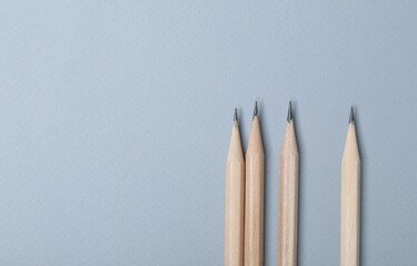 Many graphite pencils on grey background, flat lay. Space for text