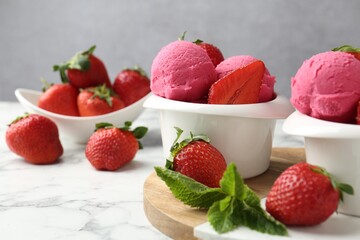 Refreshing sorbet, strawberries and mint on white marble table against grey background, closeup