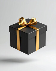 Obraz premium Black gift box with golden ribbon isolated