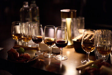 Luxury whiskey glasses in warm lighting