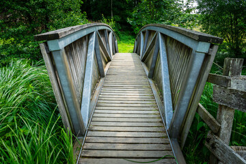 Wood and tell Bridges over the Mitternacher Ohe River in the bavarian Forests Germany.