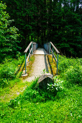 Wood and tell Bridges over the Mitternacher Ohe River in the bavarian Forests Germany.