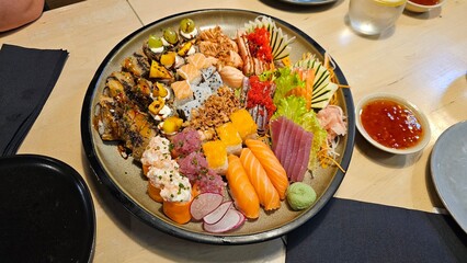 Assorted Sushi Platter with Nigiri, Rolls, Sashimi, and Garnishes