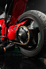 Chain tensioning at motorcycle maintenance service. Motorcycle chain maintenance is essential for...
