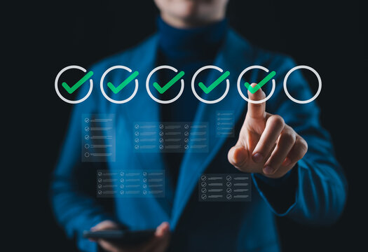 Online assessment and survey concept. Businessperson touches with virtual checklist, symbolizing online assessments, surveys, exams, or quizzes. digital evaluation and data collection. fill out form,