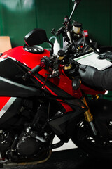 Mechanic performing system diagnostics via tablet. Motorcycle system diagnostic, scanning for...