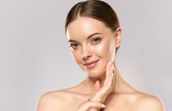 Fototapeta Beautiful Young Woman with Clean Fresh Skin . Facial treatment . Cosmetology , beauty and spa . Skin care 