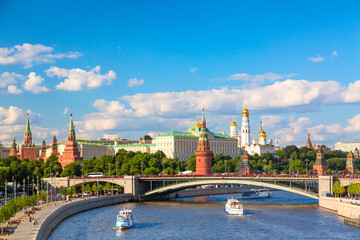 View of Moscow Kremlin, Moscow River, sightseeing ships and Big Stone bridge during summer sunny...