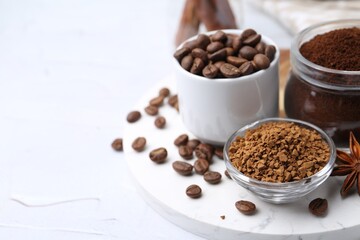 Different types of instant coffee, beans and spices on light textured table, closeup. Space for text