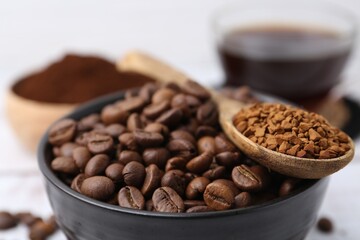 Roasted beans and granulated instant coffee on light table, closeup
