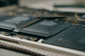 A closeup, detailed view showcasing lithiumion batteries integrated into the intricate internal structure of a laptop