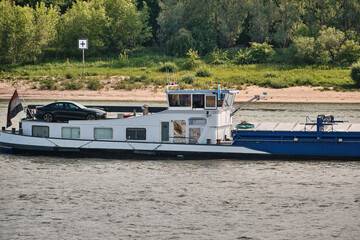 Cargo ship Natasja downstream on the Rhine with wheelhouse and cabin view