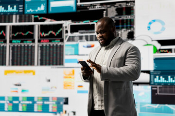 Fototapeta premium Male business leader analyzing finance charts and analytics for startup development, improving performance models for fruitful management decisions. Administrator studying big data reports.