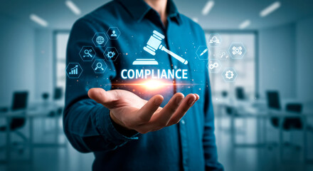 Compliance in the digital age: A man presents governance concepts including rules and law in his open hand indoors.